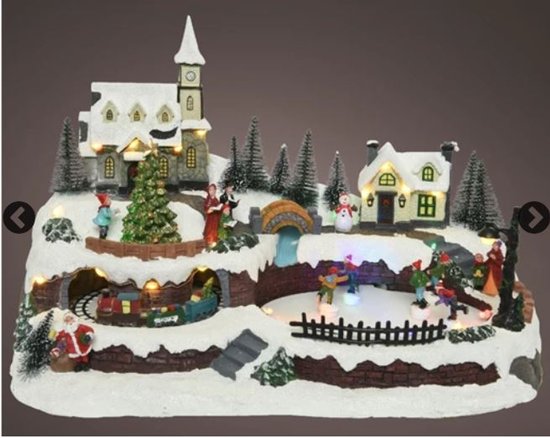 kerstdorp met schaatsers en bewegende trein, kerk, kerst, winterdorp