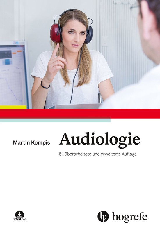 Femme portant un casque lors d'un examen audiologique, avec un graphique à l'écran.