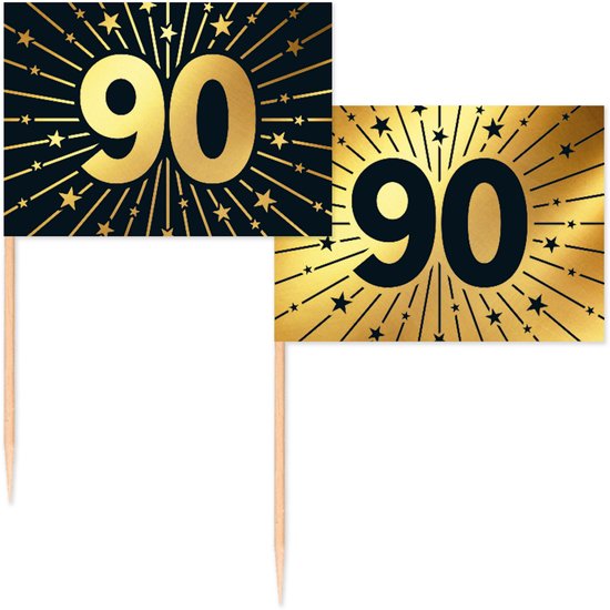 Twee vlagprikkers met '90' in goud op een donkere achtergrond met gouden sterren en uitbarstingen. Eén vlagprikker heeft een zwarte achtergrond, de ander een gouden.