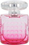 Roze parfumfles van Jimmy Choo Blossom met een glanzende, gefacetteerde dop.
