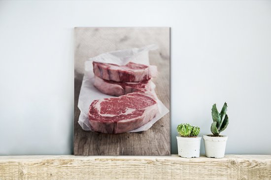 Quelques steaks crus du boucher sur toile 30x40 cm - petit - Tirage photo sur toile (Décoration murale salon / chambre)