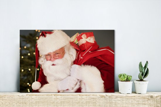 Un portrait du Père Noël portant un sac rouge sur son épaule toile 30x20 cm - petit - Tirage photo sur toile (Décoration murale salon / chambre)