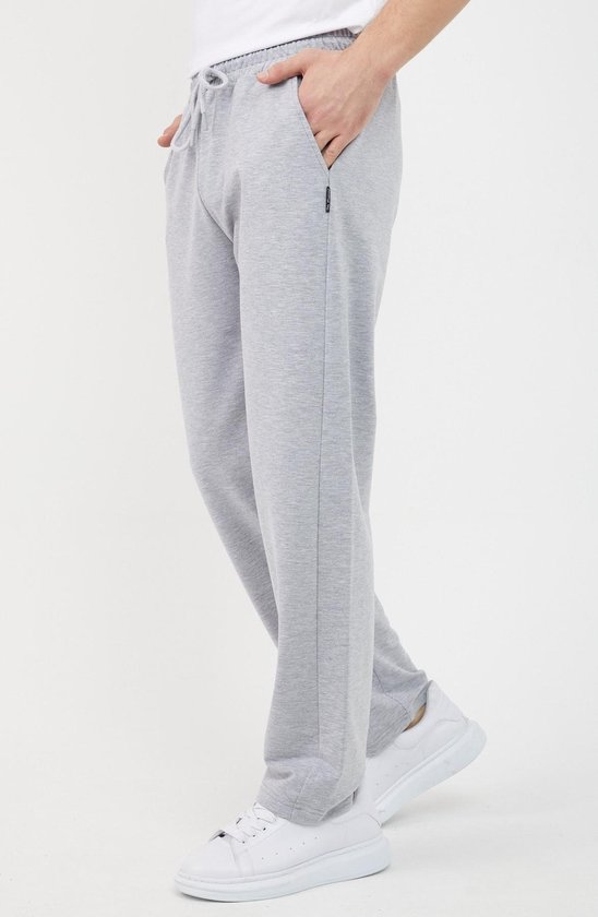 Lichtgrijze joggingbroek voor heren, detail van de zak met logo label.