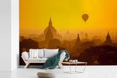 Behang - Fotobehang Oranje zonsondergang bij Bagan in Myanmar - Breedte 360 cm x hoogte 240 cm