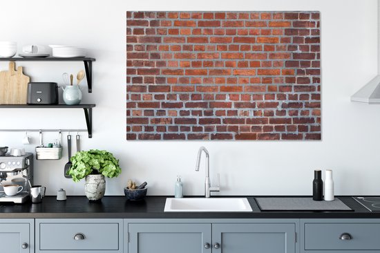 Gros plan d'un mur de brique qui a été restauré toile 2cm 140x90 cm - Tirage photo sur toile (Décoration murale salon / chambre)