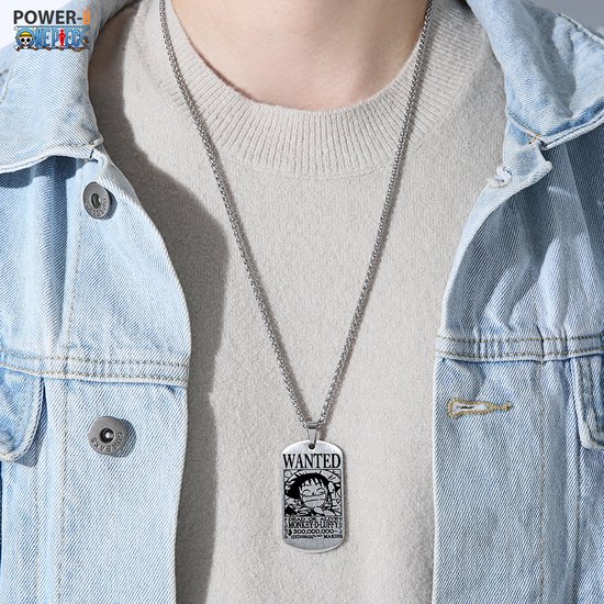 Hanger met 'Wanted' poster van Monkey D. Luffy, gedragen door een persoon met een blauwe spijkerjas.