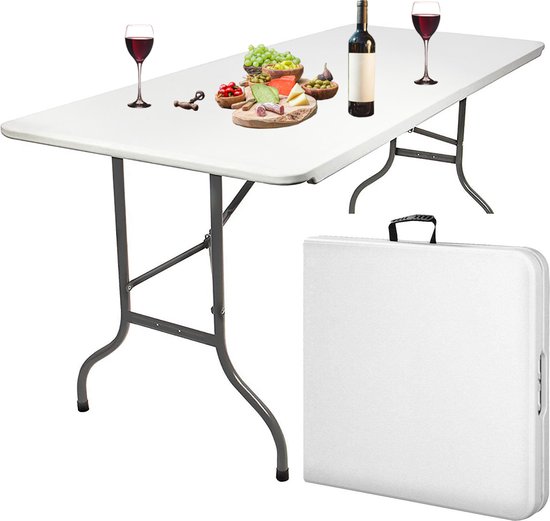 Witte, opvouwbare tafel met eten en drinken, naast de ingeklapte tafel.