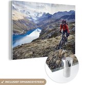 MuchoWow® Glasschilderij 30x20 cm - Schilderij acrylglas - Mountainbiker in Zwitserland - Foto op glas - Schilderijen