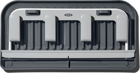 Égouttoir gris foncé avec une grille grise et un plateau amovible, vu de dessus.