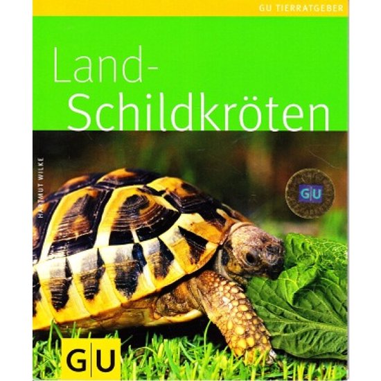 Boek 'Landschildpadden' met een close-up van een schildpad die van bladgroenten eet. De kop en het schild van de schildpad zijn duidelijk zichtbaar.