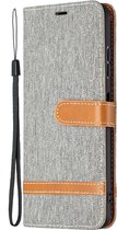 Hoesje geschikt voor Samsung Galaxy S21 - Bookcase - Pasjeshouder - Portemonnee - Vintage - Stof - Kunstleer - Grijs
