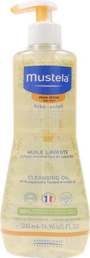 Fles Mustela doucheolie met gele pompdispenser, bedrukt met een teddybeer en groen bladerdecoratie.