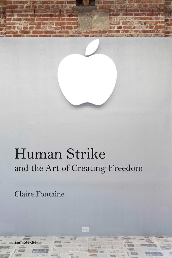 Boek "Human Strike and the Art of Creating Freedom" van Claire Fontaine, met een wit Apple logo erboven.