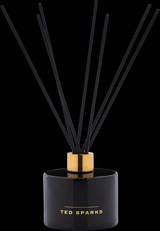 Zwarte glazen diffuser van Ted Sparks met gouden dop en 8 zwarte geurstokjes.