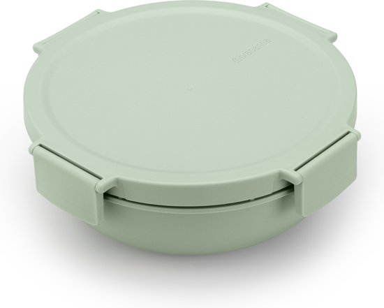 Boîte à salade vert pâle fermée avec couvercle et clips angulaires.