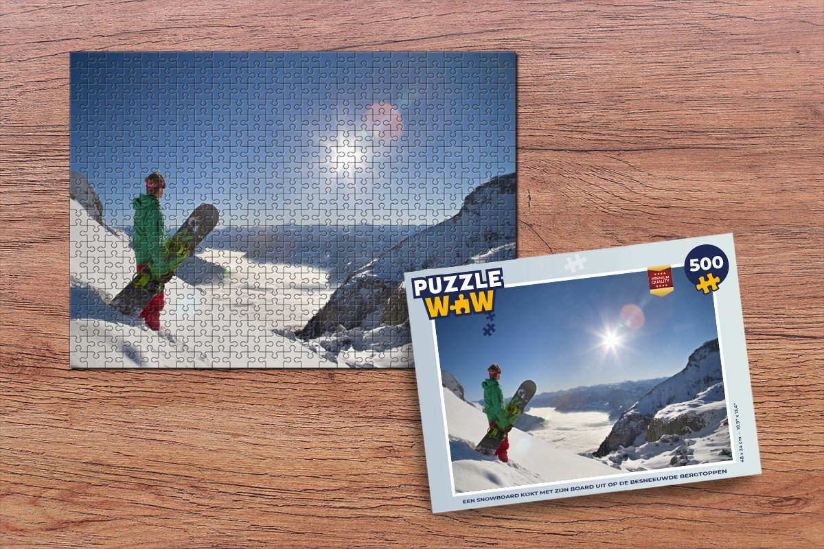 Puzzle Un snowboard regarde les sommets enneigés avec sa planche - Puzzle -  Puzzle