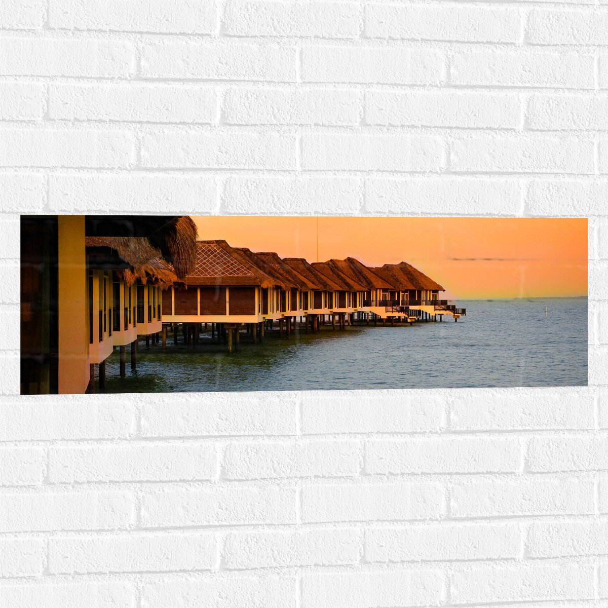 Muursticker - Huisjes op Palen in de Zee - 90x30 cm Foto op Muursticker