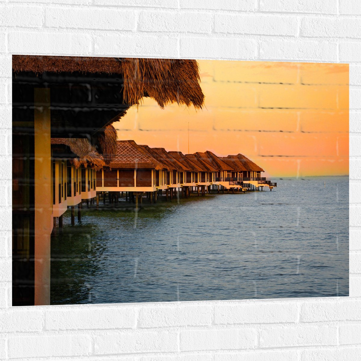 Muursticker - Huisjes op Palen in de Zee - 100x75 cm Foto op Muursticker
