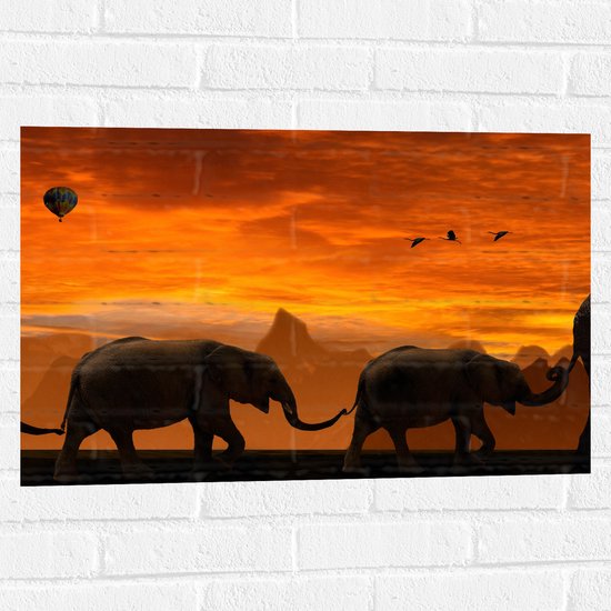 WallClassics - Muursticker - Olifanten Stoet bij Zonsondergang - 75x50 cm Foto op Muursticker