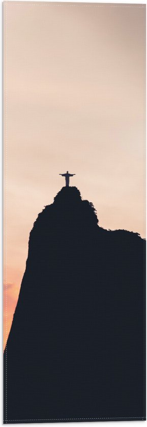 WallClassics - Vlag - Silhouet van Jezusbeeld op berg met Zonsondergang - 20x60 cm Foto op Polyester Vlag