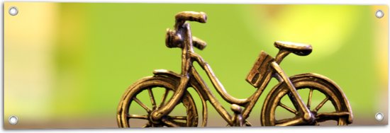 WallClassics - Tuinposter – Miniatuurbeeld van Gouden Fiets - 90x30 cm Foto op Tuinposter  (wanddecoratie voor buiten en binnen)