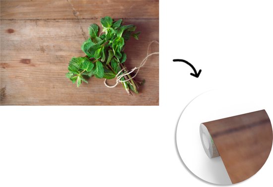 Papier peint photo en vinyle - Feuilles de menthe fraîche sur une table en bois largeur 330 cm x hauteur 220 cm - Tirage photo sur papier peint (disponible en 7 tailles)