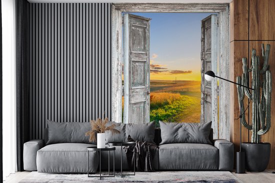 Behang - Fotobehang Doorkijk - Platteland - Landschap - Zon - Breedte 195 cm x hoogte 260 cm