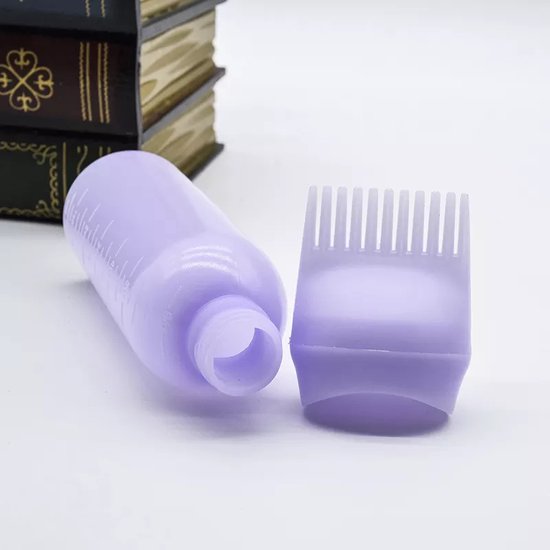 Lichtpaarse applicatorfles, losse kam met tandjes, naast elkaar.