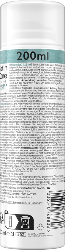 Zijkant van een witte scheergel bus met blauwgroene opdruk en tekst in meerdere talen. Tekst: '200ml', 'Satin Care', 'Aloe Vera Glide', en waarschuwingen.