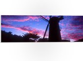 WallClassics - PVC Schuimplaat- Silhouet van Grote Molen onder Donkere Zonsondergang - 60x20 cm Foto op PVC Schuimplaat