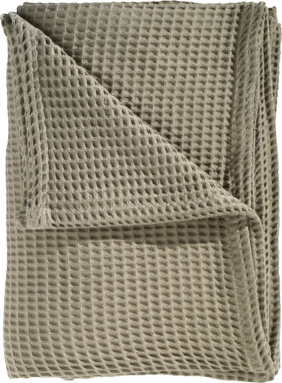 Groene wafel plaid, opgevouwen.