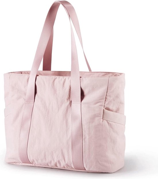 Sac fourre-tout rose pâle avec double poignée et poches extérieures.