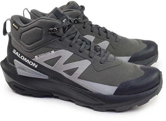 Grijze Salomon wandelschoenen voor heren met Gore-Tex. De schoenen hebben een stevige zwarte zool en een opvallend grijs zigzag-detail op de zijkant.