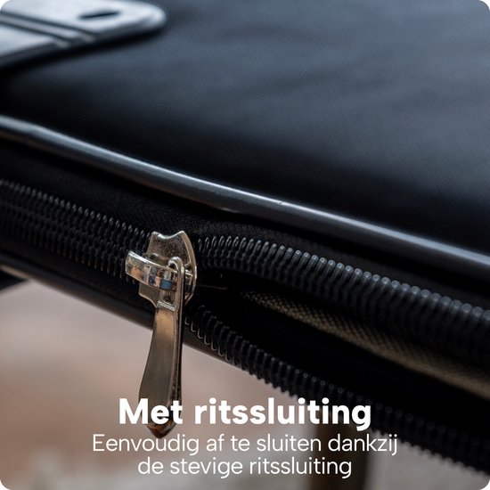 Close-up van de ritssluiting van de zwarte puzzelmap. Tekst: Met ritssluiting, eenvoudig af te sluiten dankzij de stevige ritssluiting.