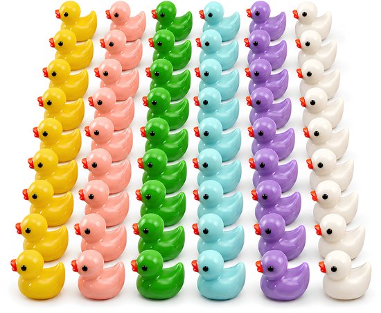 Des rangées de petits canards de bain aux couleurs vives, jaunes, roses, vertes, bleues, violettes et blanches.