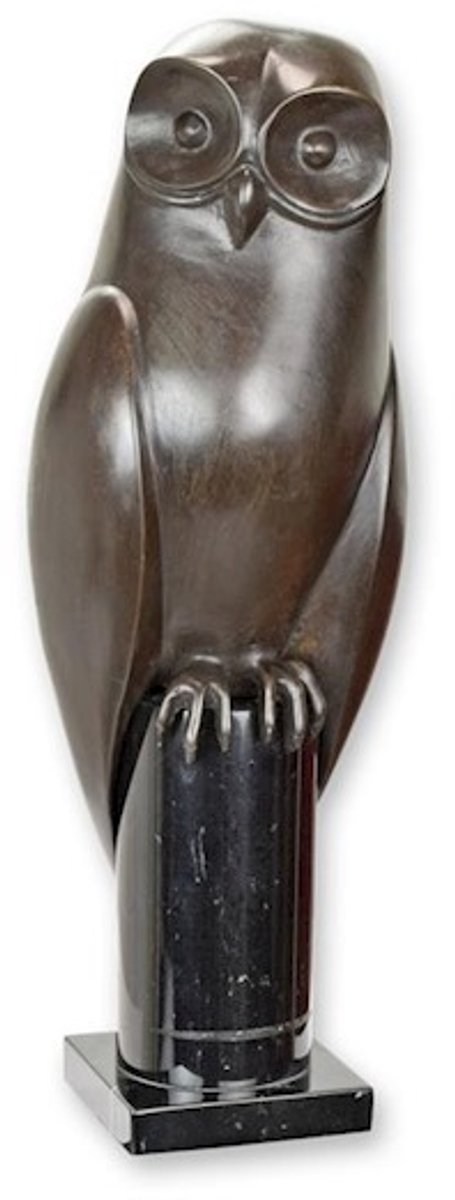 EEN BRONZEN BEELD VAN EEN UIL