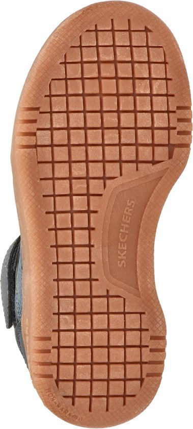 Onderkant van een bruine Skechers zool met profiel.