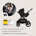 Groene kinderwagen met Astrid i-Size autostoel, getest door ADAC.
