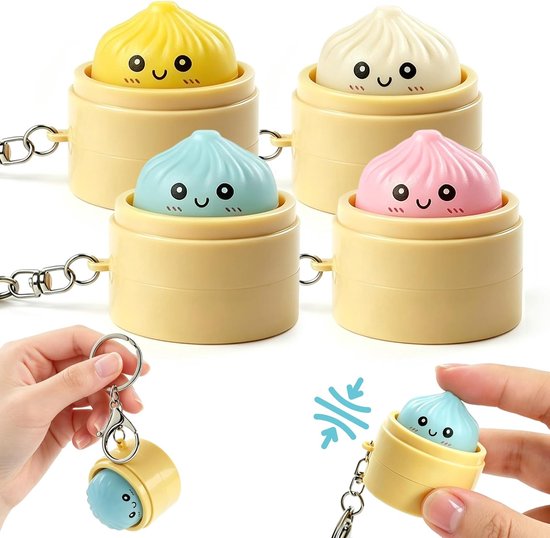 Vier dumpling sleutelhangers in geel, wit, blauw en roze, met een close-up van een blauwe dumpling uit het bakje.