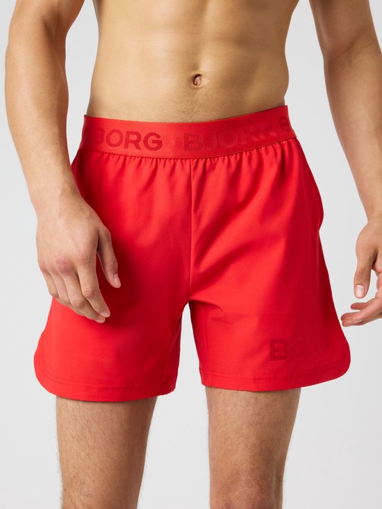 Heren korte sportbroek in vurig rood met elastische tailleband met 'BJÖRN BORG'-opdruk en de tekst 'BORG' subtiel op de pijp.