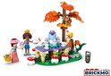 LEGO Friends speelset met twee poppen, een eekhoorn in een boom, en een theetafel.