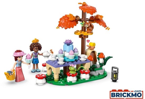 LEGO Friends speelset met twee poppen, een eekhoorn in een boom, en een theetafel.