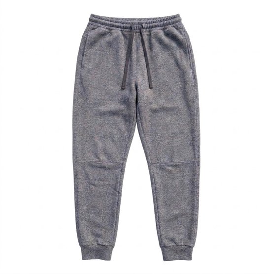 Grijze joggingbroek met een subtiel patroon, trekkoord en boorden.
