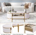 Ovale salontafel met marmerlook blad, wit geribbeld design en gouden poten.