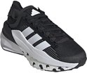 Baskets noires pour femme avec bandes blanches Adidas, semelle blanche et accents blancs.