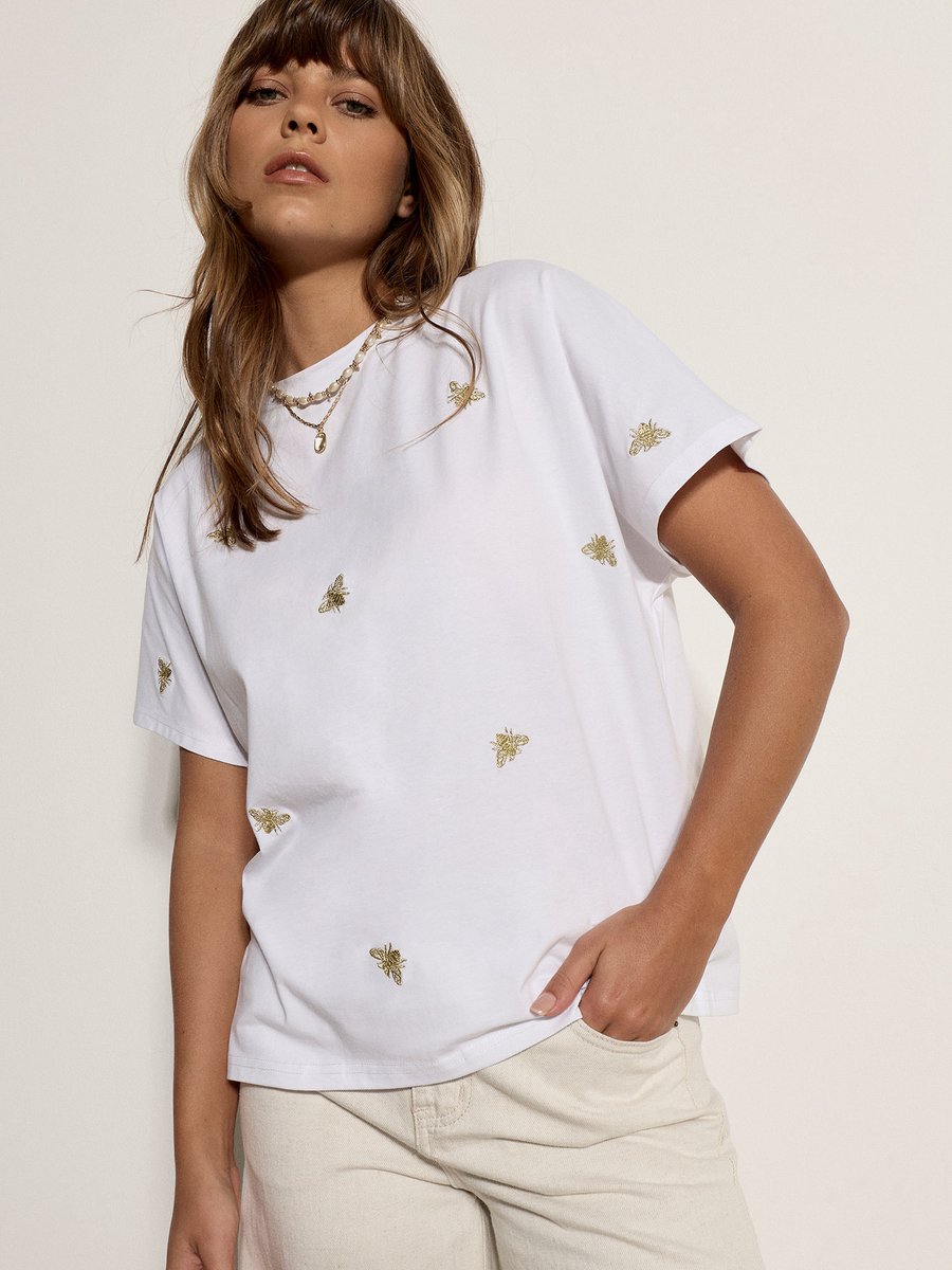 T-shirt met geborduurde gouden bij