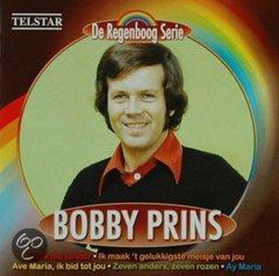 Albumhoes met een glimlachende Bobby Prins in een rode coltrui, met de tekst 'De Regenboog Serie' en songtitels.