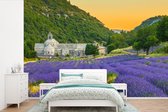 Behang - Fotobehang Oranje lucht boven dal van lavendelbloemen - Breedte 360 cm x hoogte 240 cm