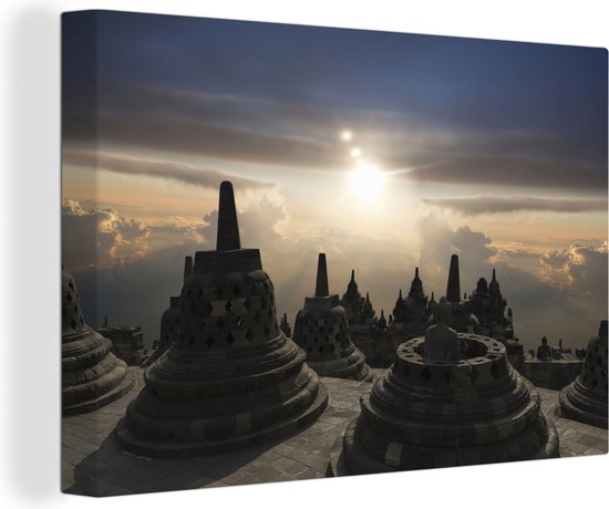 Canvas schilderij 150x100 cm - Wanddecoratie Borobudur bij zonsondergang - Muurdecoratie woonkamer - Slaapkamer decoratie - Kamer accessoires - Schilderijen