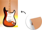 Behang - Fotobehang Een elektrische gitaar met een oranje achtergrond - Breedte 190 cm x hoogte 280 cm